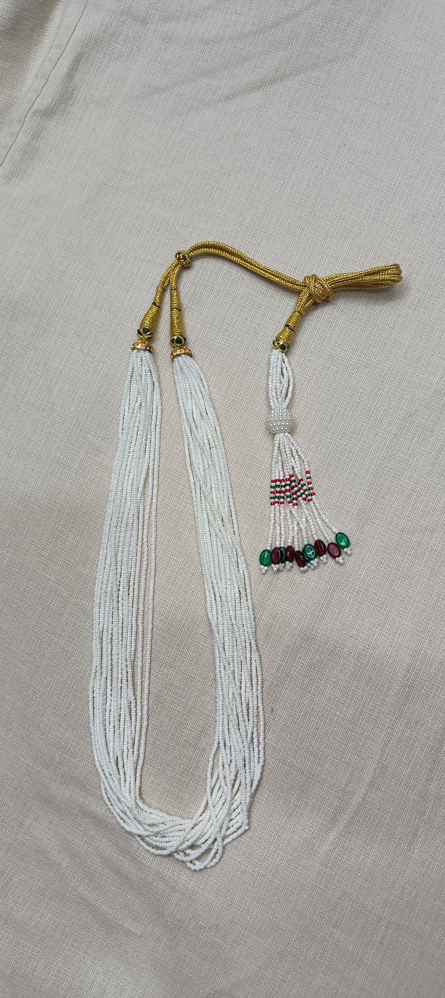 Graceful Multi-Strand White Bead Necklace with Colorful Tassel