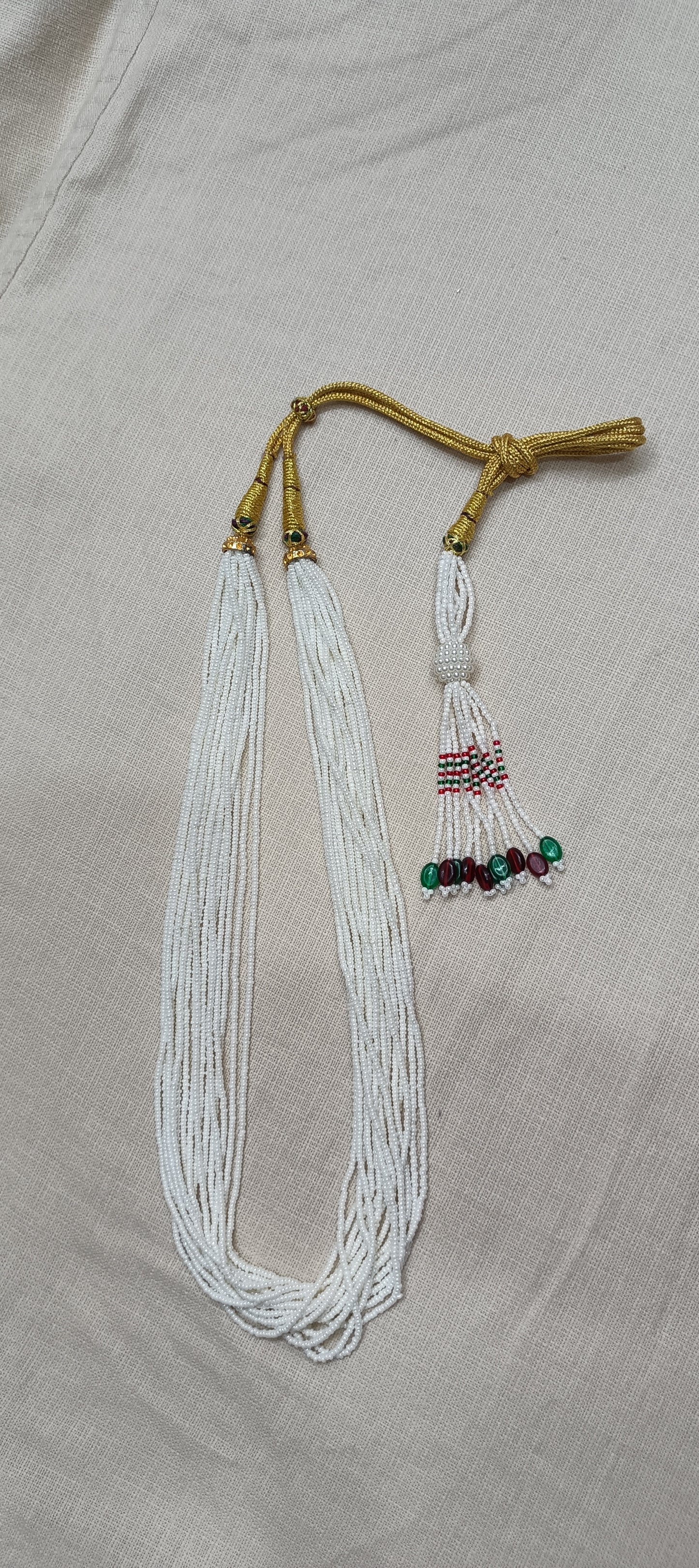 Graceful Multi-Strand White Bead Necklace with Colorful Tassel