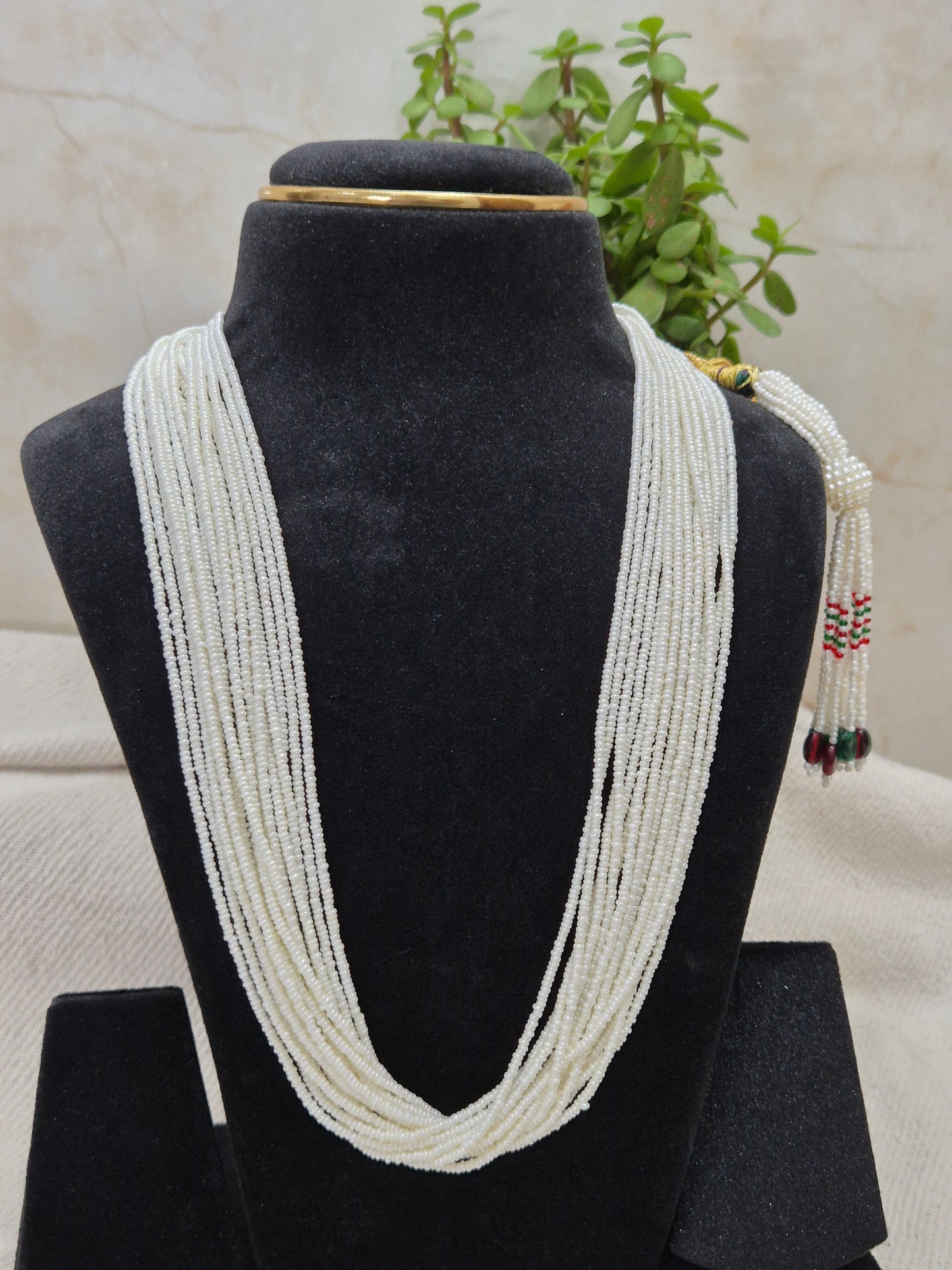 Graceful Multi-Strand White Bead Necklace with Colorful Tassel