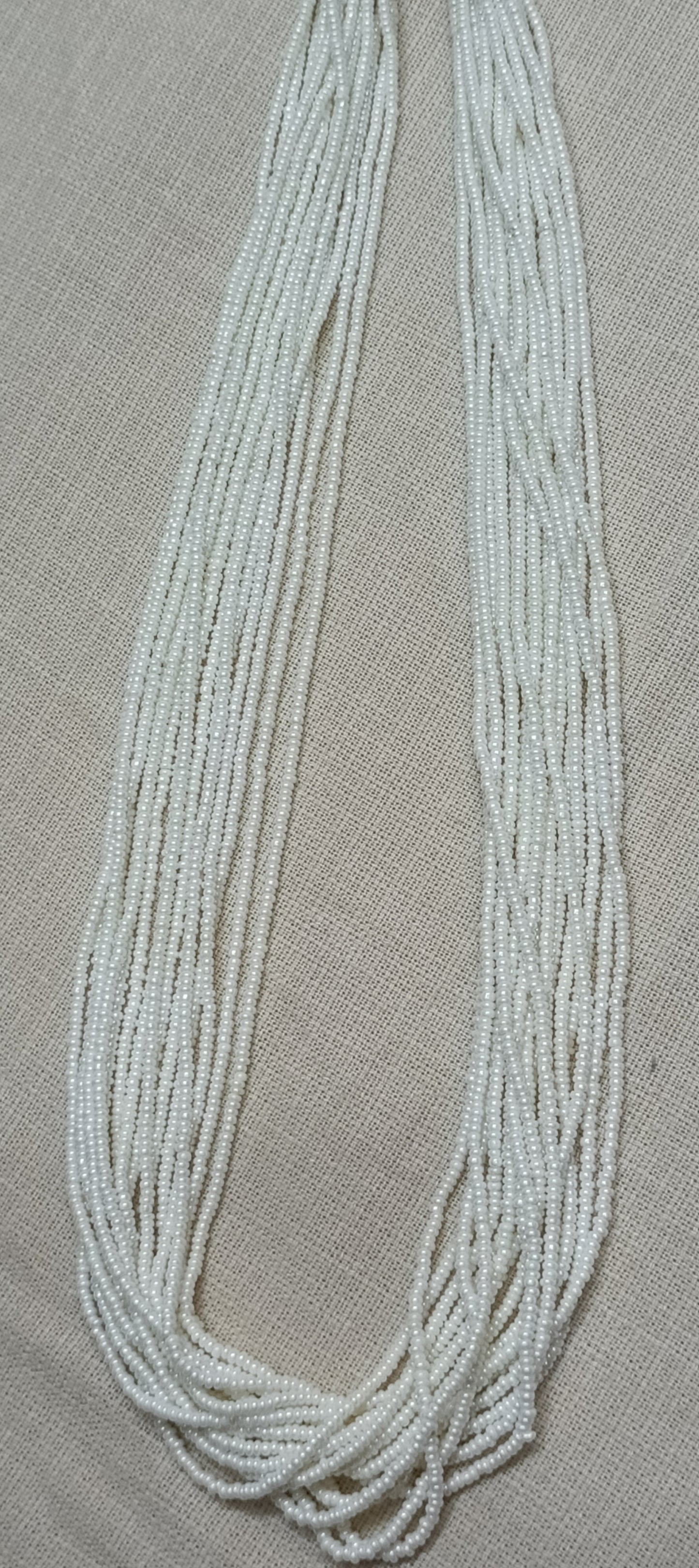 Graceful Multi-Strand White Bead Necklace with Colorful Tassel