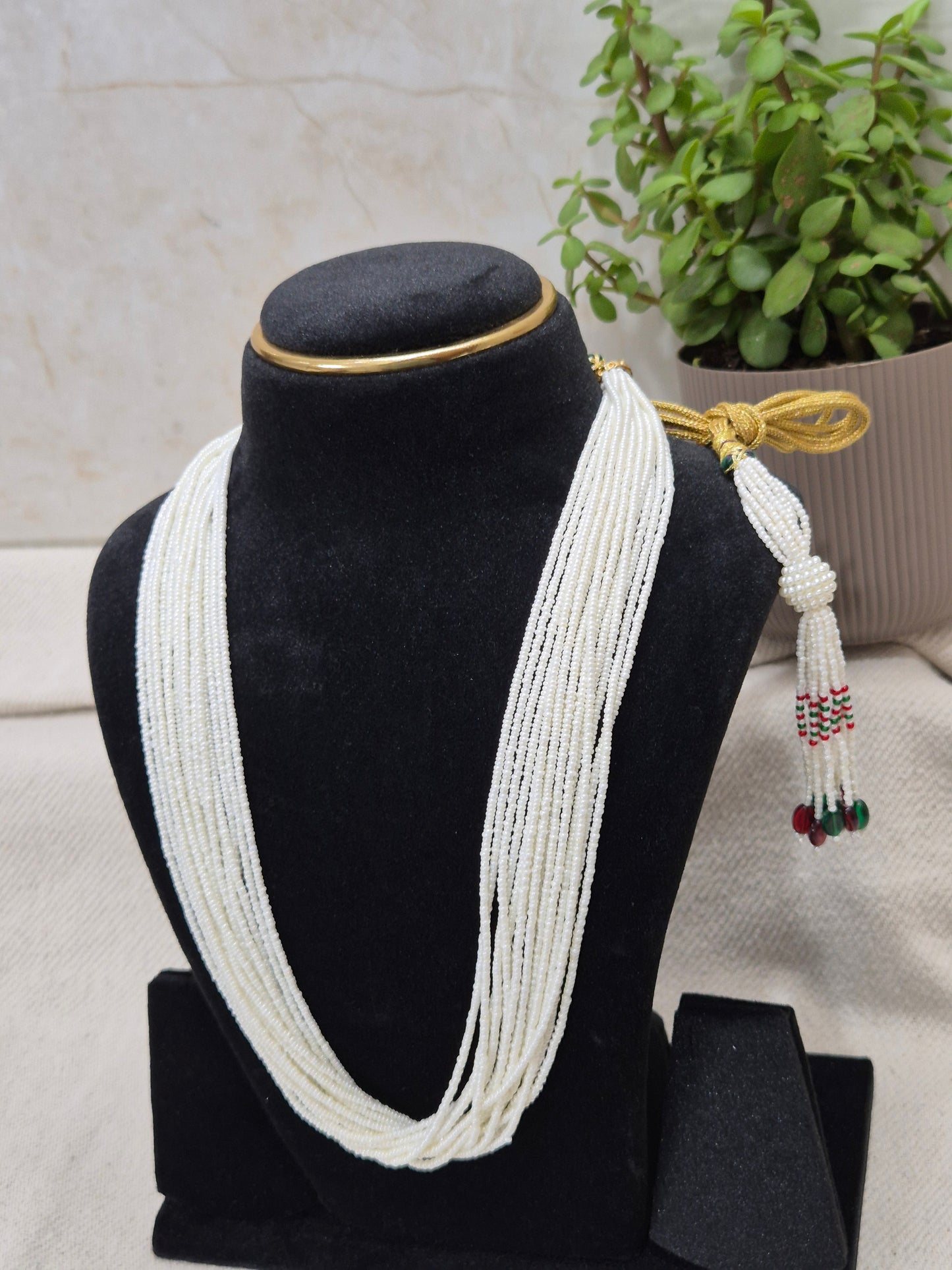 Graceful Multi-Strand White Bead Necklace with Colorful Tassel