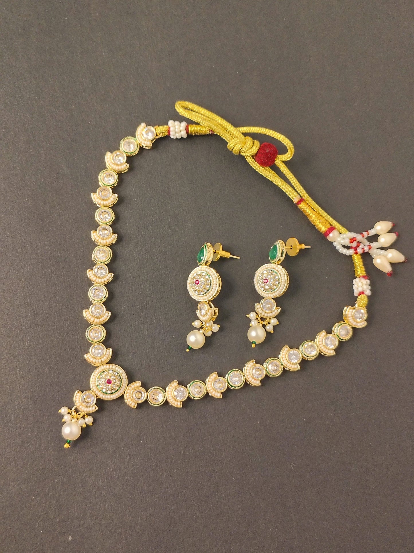 Meera Kundan Green & Golden Emerald Drop Choker With Earrings Set